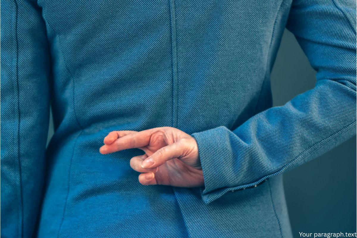 Man with crossed fingers behind his back.