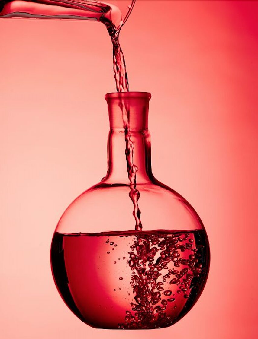 Flask with water pouring in.