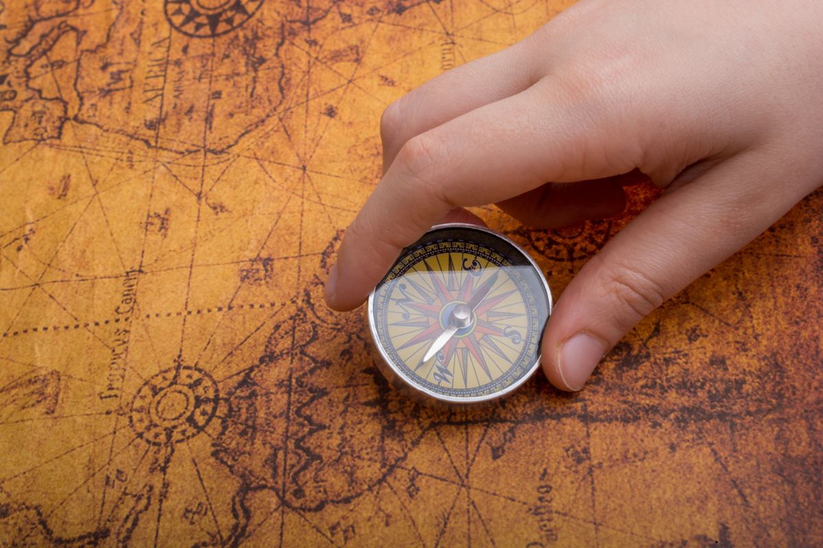 Man holding a compass